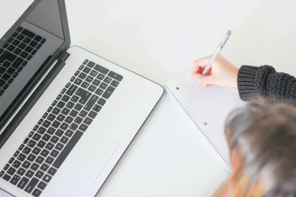 A woman sat at a computer