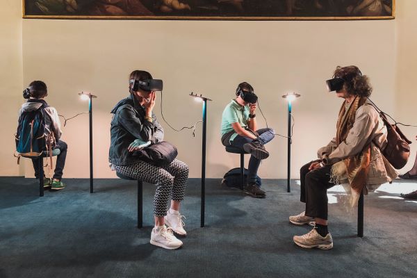 A group of people wearing VR headsets