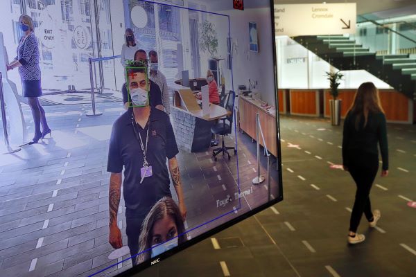 A man wearing a mask on a TV screen