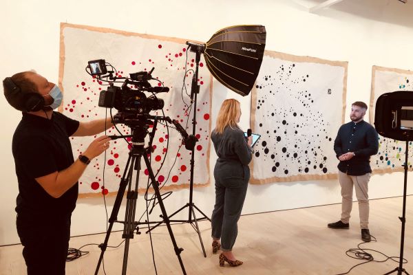 A camera crew filming at the Saatchi gallery