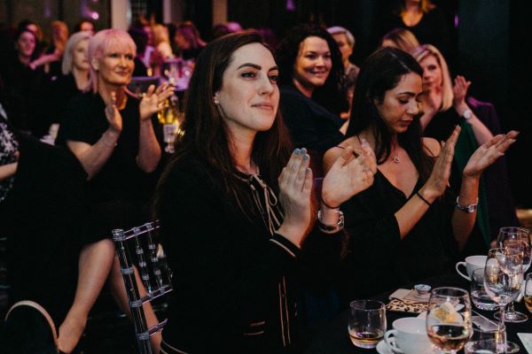 A group of women clapping