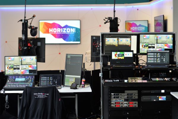 The Horizon Virtual and Hybrid Streaming studio, a room set up with multiple computer screens and microphones