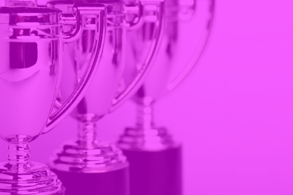 Silver trophies with a pink overlay