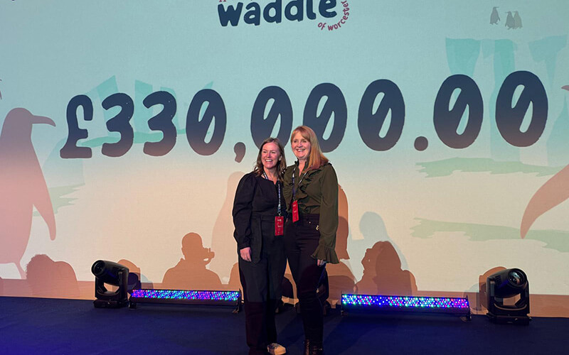 Sara Matthews and Tricia Cavell from St Richard's Hospice reveal the auction total
