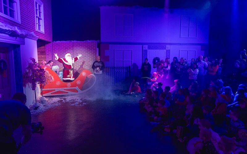 1. Picture of Santa delivering presents at DRPG's Studio 212