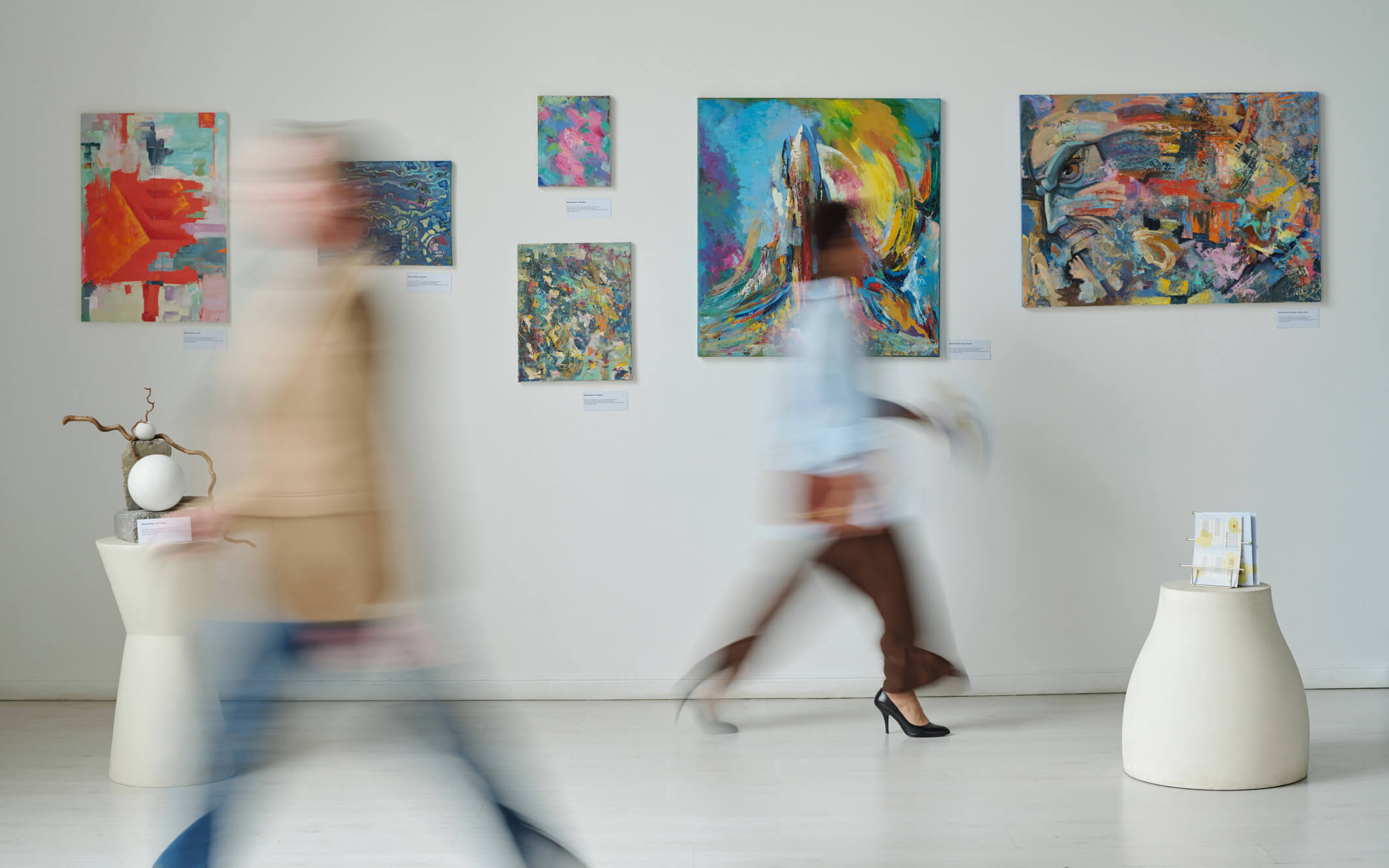 Blurred motion of people in art gallery