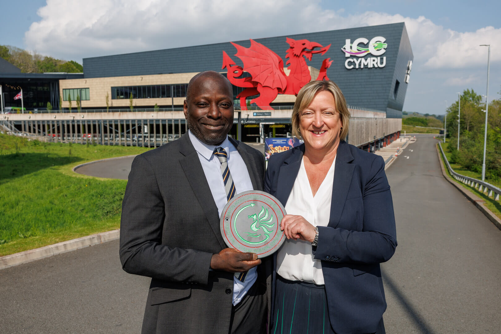 Celtic-Collection-Energy-and-Environment-Manager-Fitzroy-Hutchinson-and-ICC-Wales-Venue-Director-Nancy-Mollett-with-the-Green-Dragon-Level-4-Environmental-Standard.jpg
