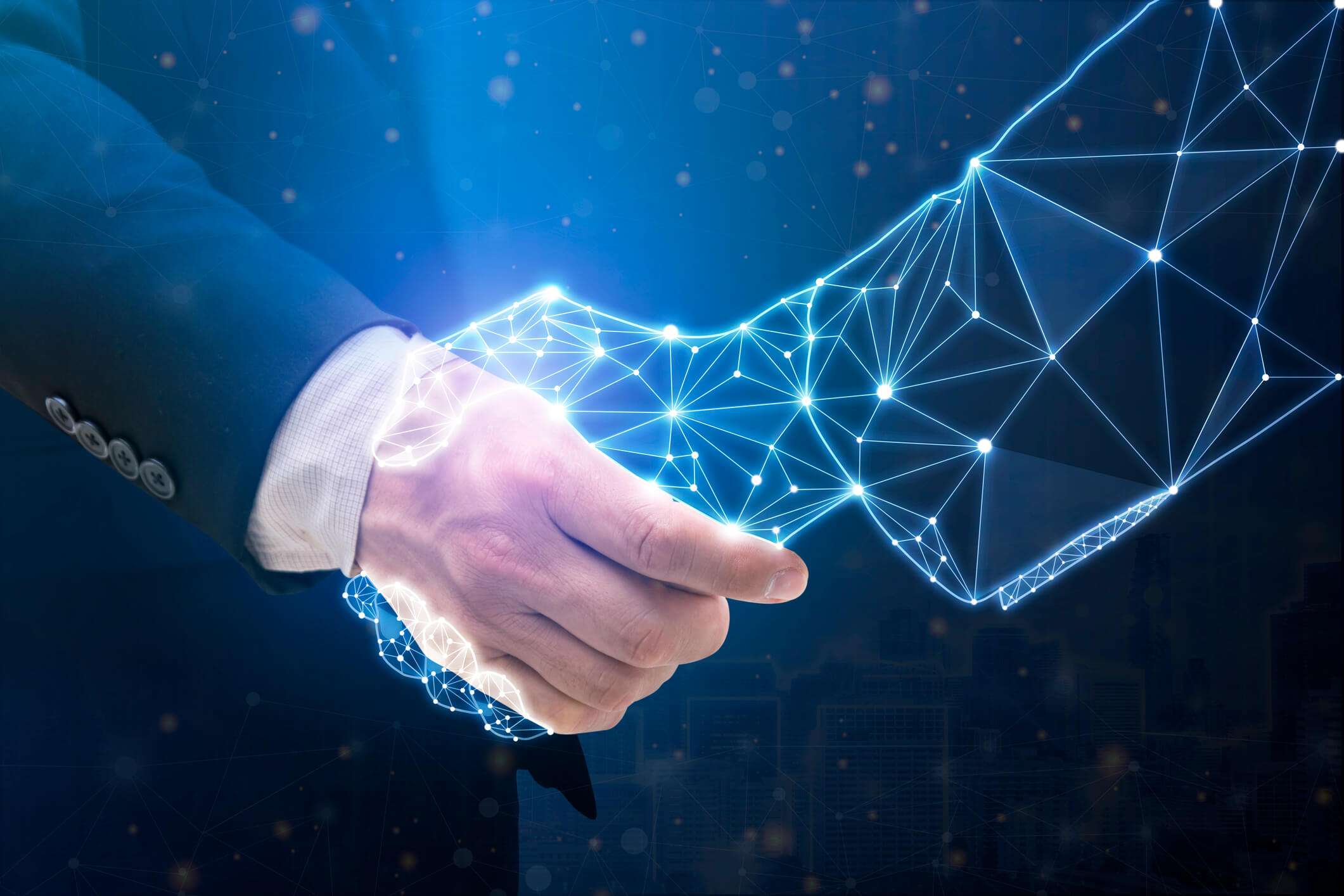 Businessperson shaking hand with digital partner over