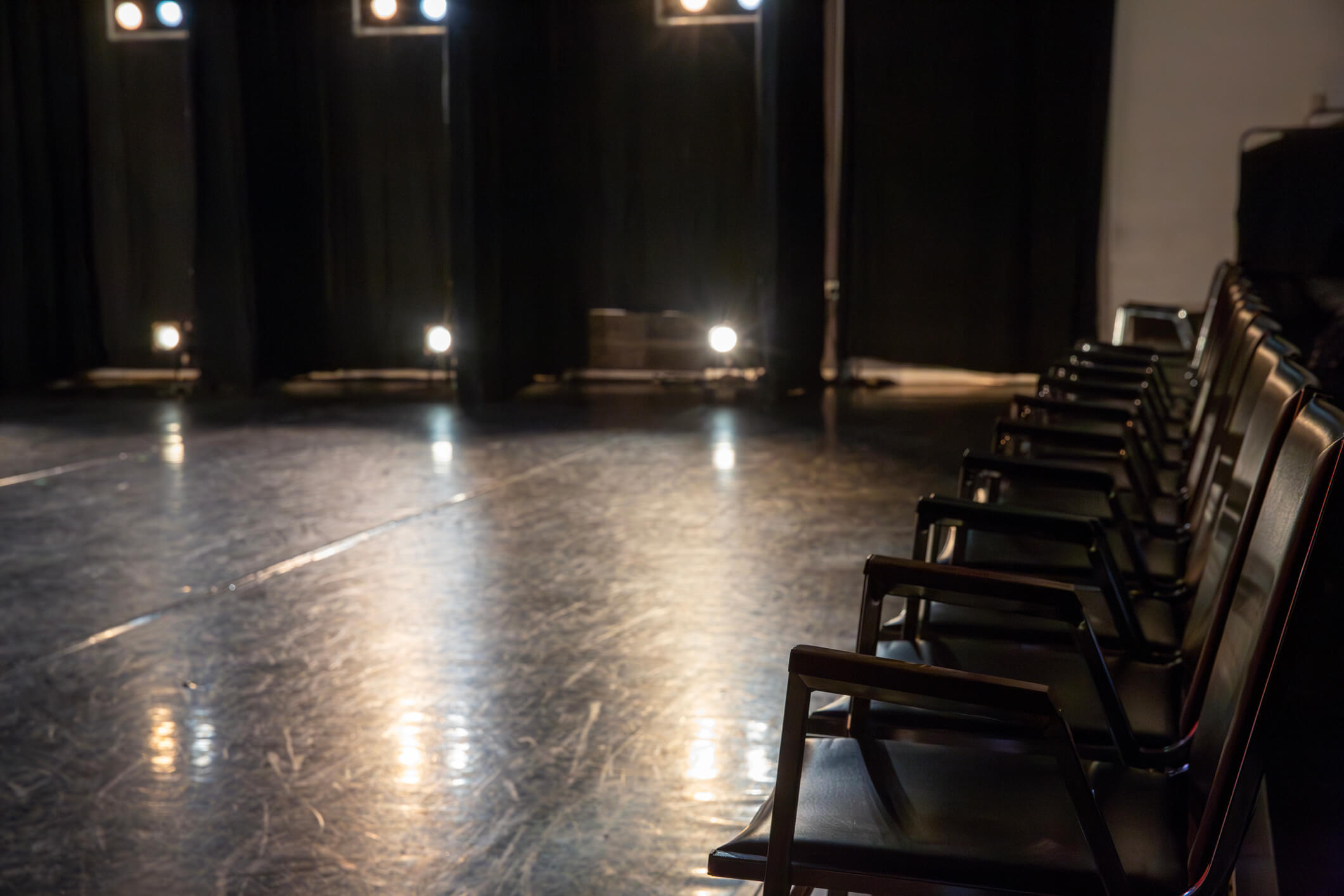 Empty seats just before a stage performance.