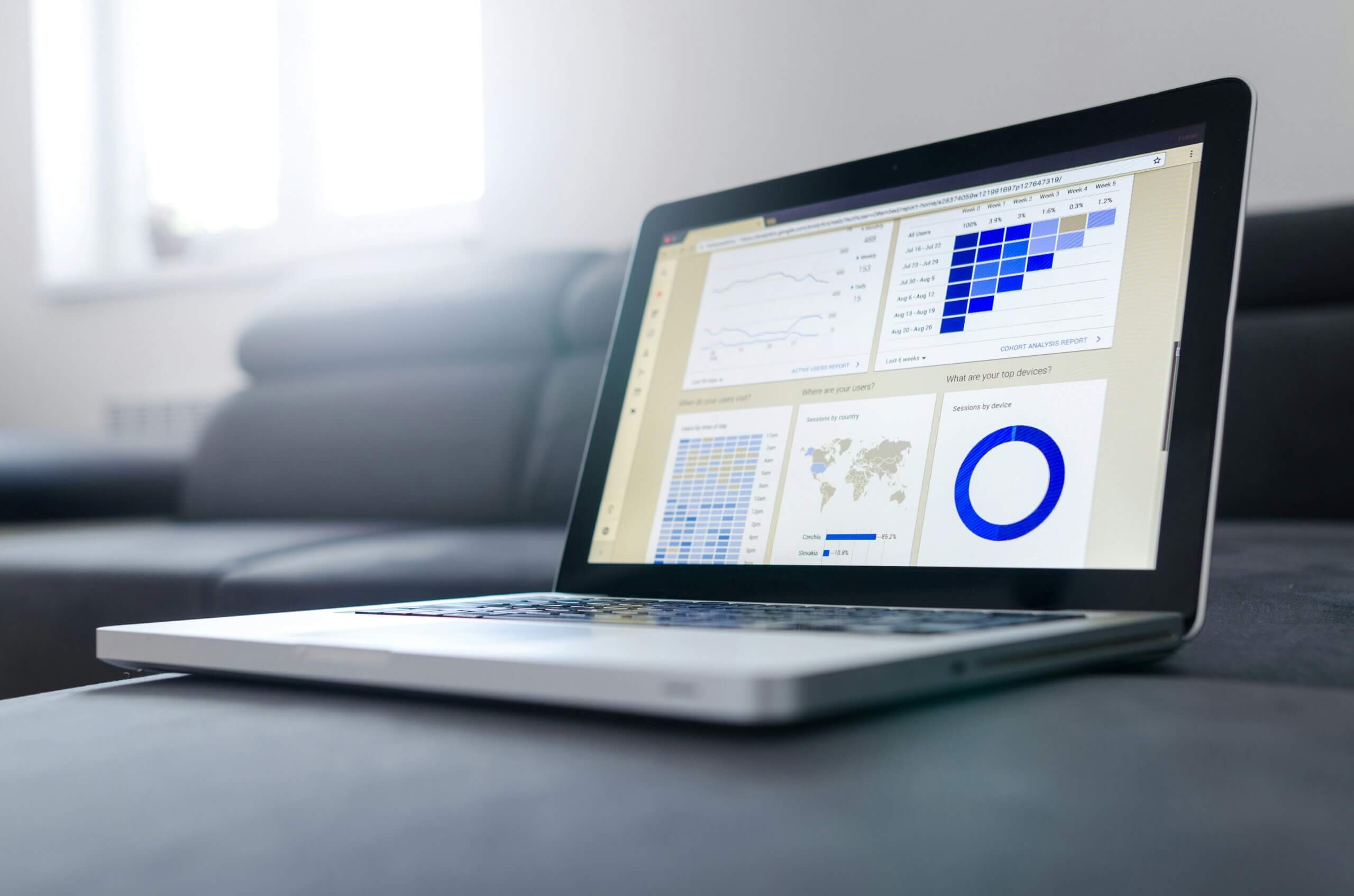 photo of a laptop and reports from unsplash