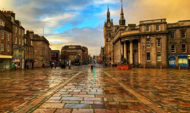 The Castlegate at the top end of Union Street in Aberdeen, Scotland during the rain.
