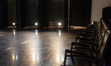 Empty seats just before a stage performance.