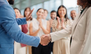 People, handshake or applause at business, success or thank you as motivation, trust or support. Businessman, employee or shaking hands at work, recruitment or promotion as wow career achievement