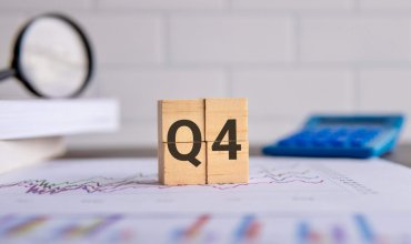 Close up image of wooden cubes with alphabet Q4 on office desk. Fourth quarter concept.