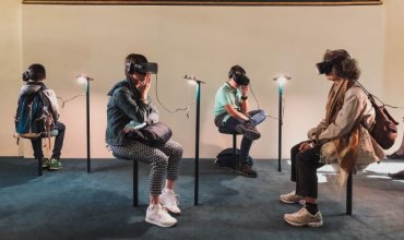 A group of people wearing VR headsets