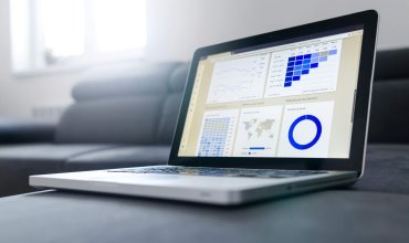 photo of a laptop and reports from unsplash