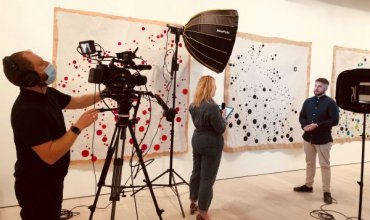 A camera crew filming at the Saatchi gallery