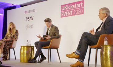 UKickstart main panel, two men and a woman sat on a stage